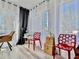 Bright dining area with modern chairs and large windows at 8651 10Th N St # 130, St Petersburg, FL 33702
