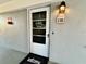 Inviting condo front door with a welcome mat and wreath at 8651 10Th N St # 130, St Petersburg, FL 33702