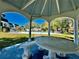 Relaxing gazebo with seating, overlooking the community pool at 8651 10Th N St # 130, St Petersburg, FL 33702