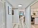 Bright hallway with light wood floors leading to living areas at 8651 10Th N St # 130, St Petersburg, FL 33702