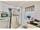 Modern kitchen with stainless steel appliances and granite counters at 8651 10Th N St # 130, St Petersburg, FL 33702