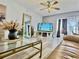 Spacious living room with a large TV and comfy leather sofa at 8651 10Th N St # 130, St Petersburg, FL 33702