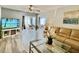 Bright and airy living room featuring a large TV and ample seating at 8651 10Th N St # 130, St Petersburg, FL 33702