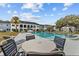 Community pool with a gazebo and lounge chairs at 8651 10Th N St # 130, St Petersburg, FL 33702