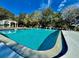 Inviting community pool with a gazebo and ample surrounding space at 8651 10Th N St # 130, St Petersburg, FL 33702