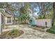 Landscaped backyard with a water feature and seating area at 8703 Cypress Mill Ct, Tampa, FL 33647