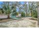 Relaxing backyard with a small pool, fountain, and lush landscaping at 8703 Cypress Mill Ct, Tampa, FL 33647
