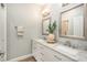 Modern bathroom with double sinks and marble countertops at 8703 Cypress Mill Ct, Tampa, FL 33647