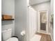 Clean bathroom with toilet, shower, and exterior access at 8703 Cypress Mill Ct, Tampa, FL 33647