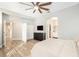Bright bedroom with a queen bed, dresser, and double-door closet at 8703 Cypress Mill Ct, Tampa, FL 33647