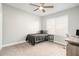 Small bedroom with twin bed, desk, and window at 8703 Cypress Mill Ct, Tampa, FL 33647