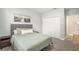 Cozy bedroom with a full bed and built-in closet at 8703 Cypress Mill Ct, Tampa, FL 33647