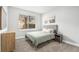 Serene bedroom with a full bed, window, and dresser at 8703 Cypress Mill Ct, Tampa, FL 33647