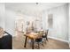 Bright dining room with a wooden table and chandelier at 8703 Cypress Mill Ct, Tampa, FL 33647
