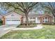 Cute pink and brick house with a white door at 8703 Cypress Mill Ct, Tampa, FL 33647