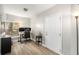 Home office with built-in desk, comfortable chair, and plenty of natural light at 8703 Cypress Mill Ct, Tampa, FL 33647
