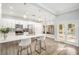Bright kitchen with white cabinets and breakfast bar at 8703 Cypress Mill Ct, Tampa, FL 33647
