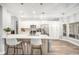 Modern kitchen with white cabinets and an island at 8703 Cypress Mill Ct, Tampa, FL 33647