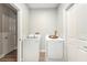 Convenient laundry room with washer and dryer at 8703 Cypress Mill Ct, Tampa, FL 33647