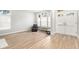 Spacious living room with hardwood floors and access to front entry at 8703 Cypress Mill Ct, Tampa, FL 33647