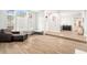 Open concept living area with hardwood floors and ample natural light at 8703 Cypress Mill Ct, Tampa, FL 33647