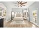 Spacious main bedroom with king-size bed and access to backyard at 8703 Cypress Mill Ct, Tampa, FL 33647