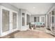 Cozy screened porch with comfy seating and access to outdoors at 8703 Cypress Mill Ct, Tampa, FL 33647