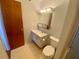 Bathroom with toilet and sink vanity at 889 Sky Loch S Dr, Dunedin, FL 34698