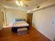 Bright bedroom with wood flooring and a ceiling fan at 889 Sky Loch S Dr, Dunedin, FL 34698