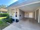 Carport with access to the front door of the house at 889 Sky Loch S Dr, Dunedin, FL 34698