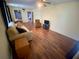 Living room with laminate flooring and a couch at 889 Sky Loch S Dr, Dunedin, FL 34698