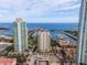 Aerial view of high rise building, marina, and bay at 100 Beach Ne Dr # 1501, St Petersburg, FL 33701