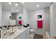 Bright bathroom with white vanity, bathtub, and shower at 100 Beach Ne Dr # 1501, St Petersburg, FL 33701