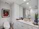 Bathroom with a single sink vanity and large mirror at 100 Beach Ne Dr # 1501, St Petersburg, FL 33701
