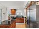 Modern kitchen with granite countertops and wood cabinets at 100 Beach Ne Dr # 1501, St Petersburg, FL 33701