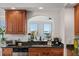 Kitchen features granite countertops, wood cabinets, and a view at 100 Beach Ne Dr # 1501, St Petersburg, FL 33701