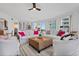 Living area with white sofas, large windows and city views at 100 Beach Ne Dr # 1501, St Petersburg, FL 33701