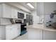 Modern kitchen with white shaker cabinets and quartz countertops at 10355 Paradise Blvd # 211, Treasure Island, FL 33706