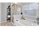 Bathroom with soaking tub and walk-in shower at 10618 Foxcrest Way, Riverview, FL 33569