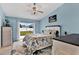 Spacious bedroom with sliding doors to the backyard at 10618 Foxcrest Way, Riverview, FL 33569