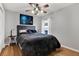 Guest bedroom with ceiling fan and large window at 10618 Foxcrest Way, Riverview, FL 33569