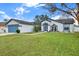 One-story home with attached garage, well-maintained lawn and landscaping at 10618 Foxcrest Way, Riverview, FL 33569