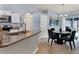 Kitchen features granite countertops, stainless steel appliances, and breakfast bar at 10618 Foxcrest Way, Riverview, FL 33569