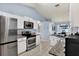 Bright kitchen boasts stainless steel appliances and granite counters at 10618 Foxcrest Way, Riverview, FL 33569