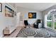 Living room features hardwood floors, large windows, and comfortable seating at 10618 Foxcrest Way, Riverview, FL 33569