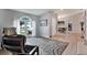 Bright living room with hardwood floors, comfortable seating and large windows at 10618 Foxcrest Way, Riverview, FL 33569