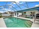 Inviting screened pool with steps and surrounding patio at 10618 Foxcrest Way, Riverview, FL 33569