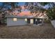 Backyard with screened porch and mature trees at 11592 110Th Ter, Seminole, FL 33778