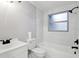 Clean bathroom with white vanity and marble tile at 11592 110Th Ter, Seminole, FL 33778