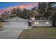 Charming single story home with gray exterior and two-car garage at 11592 110Th Ter, Seminole, FL 33778
